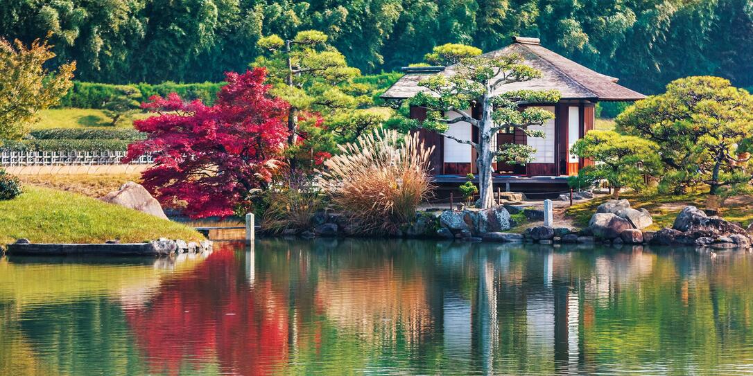 Okayama, Japan - November 17 2013: Shima-Jaya Teahouse located in the center of the garden in Sawa-no-ike pond in Koraku-en garden