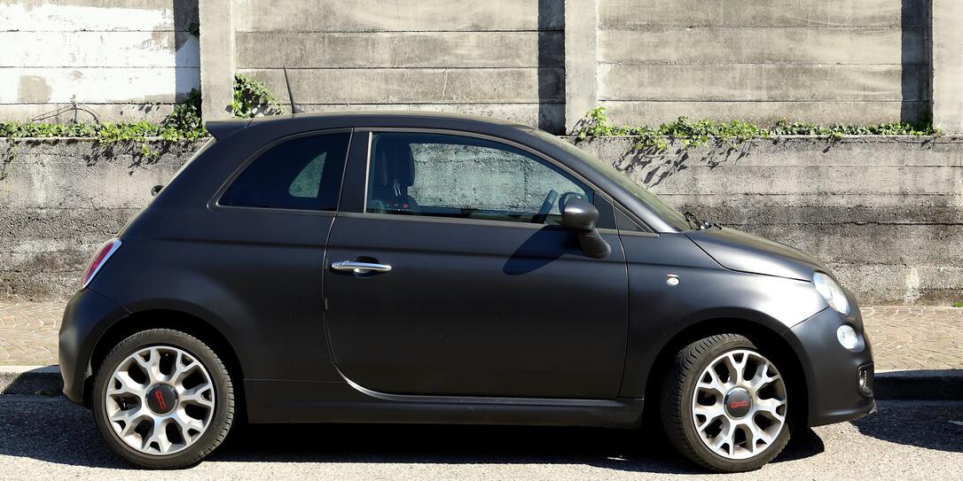 Side view of matt black new Fiat 500.