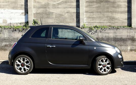 Side view of matt black new Fiat 500.