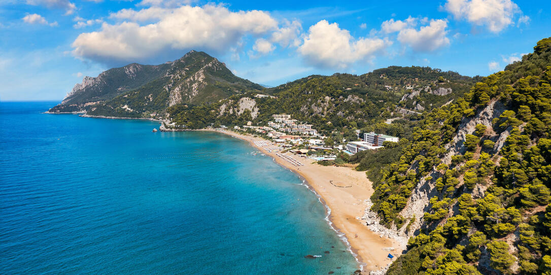 Aerial drone view over western coast and Glyfada beach, Island of Corfu, Greece. Glyfada Beach at Corfu Greece during the day.