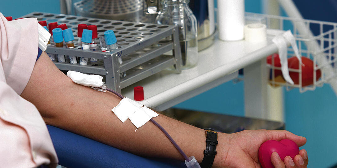 A close up of some blood being extracted from an arm