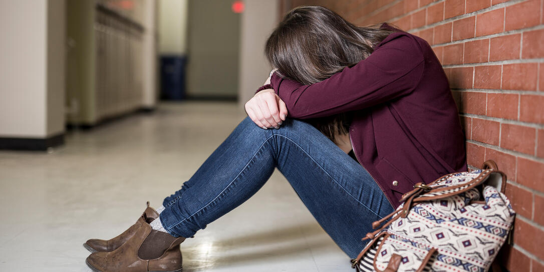 A Young depress female student at the college