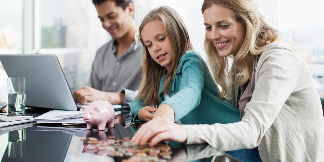 Mother and daughter counting coins