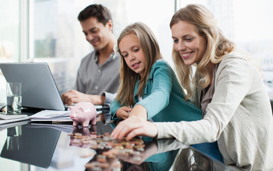 Mother and daughter counting coins