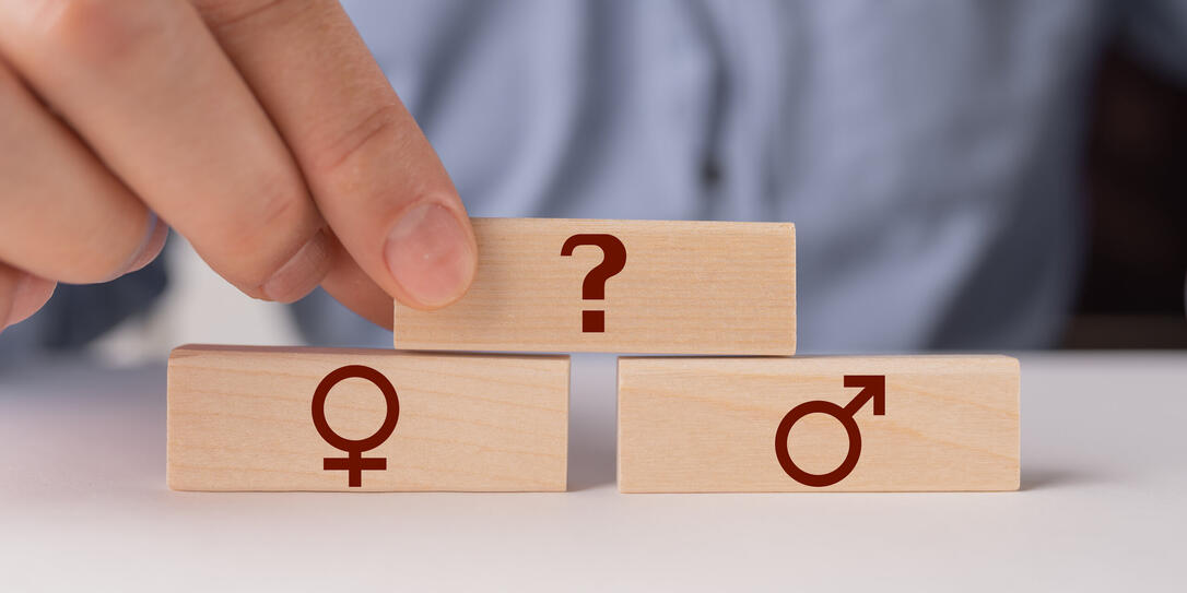 Sign of a man and a woman with a question . The concept of gender indeterminacy.