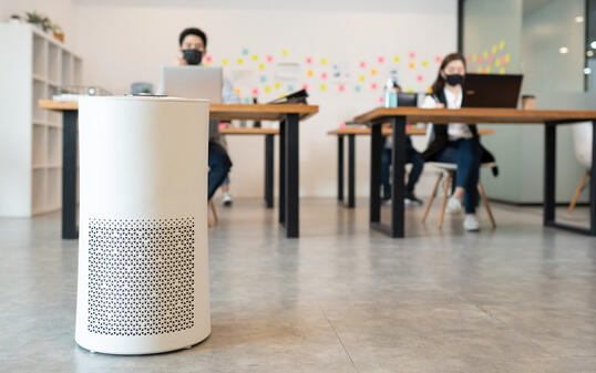 Air purifier in modern office for fresh air and removal dust PM 2.5