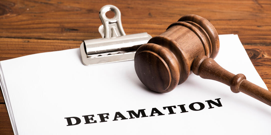 Defamation file in court with gavel