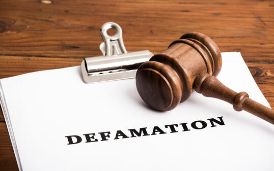 Defamation file in court with gavel