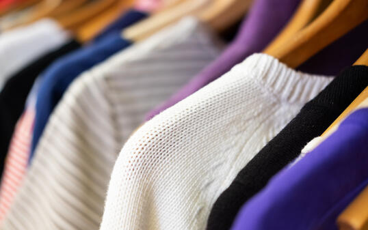 Rack of Sweaters in Second Hand Store