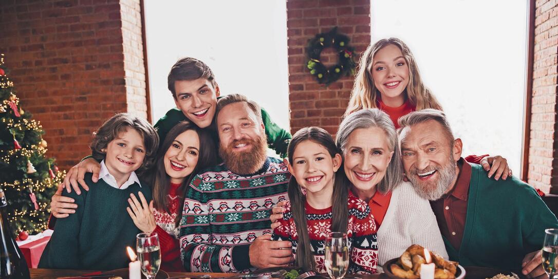 Photo of group family members cuddle posing gather celebrate christmas apartment indoors