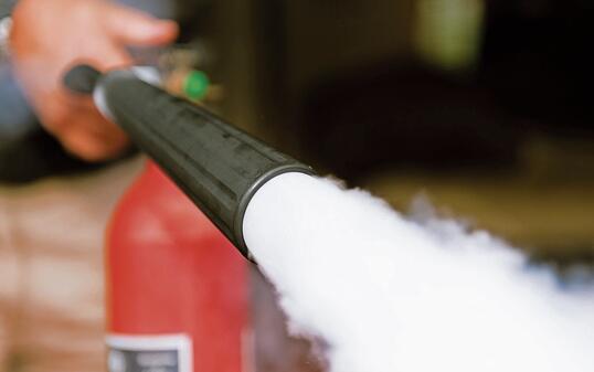 Fire extinguisher being used indoors